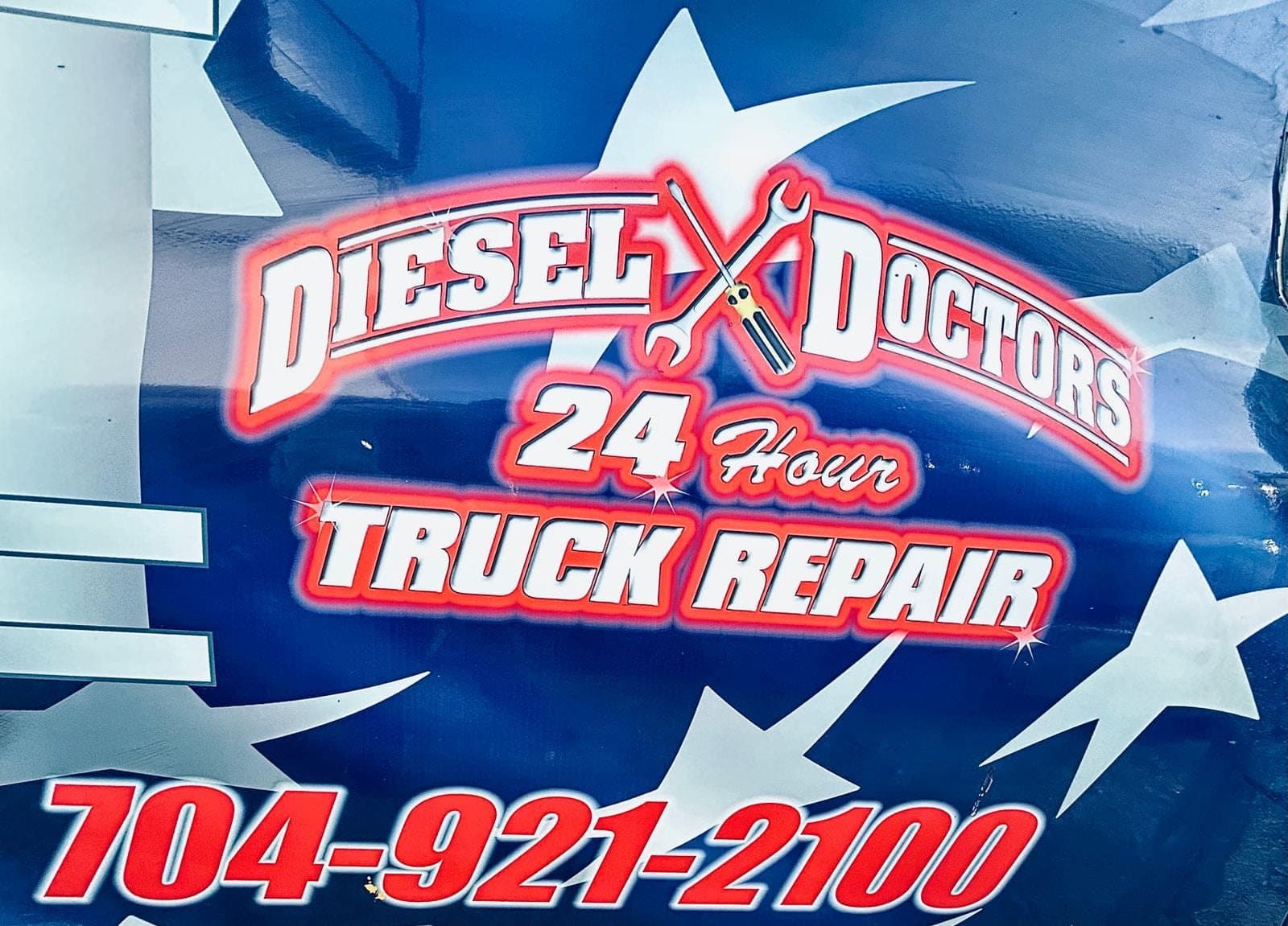 The shop's star banner: Diesel Doctors, 24 Hour Truck Repair, 704-921-2100