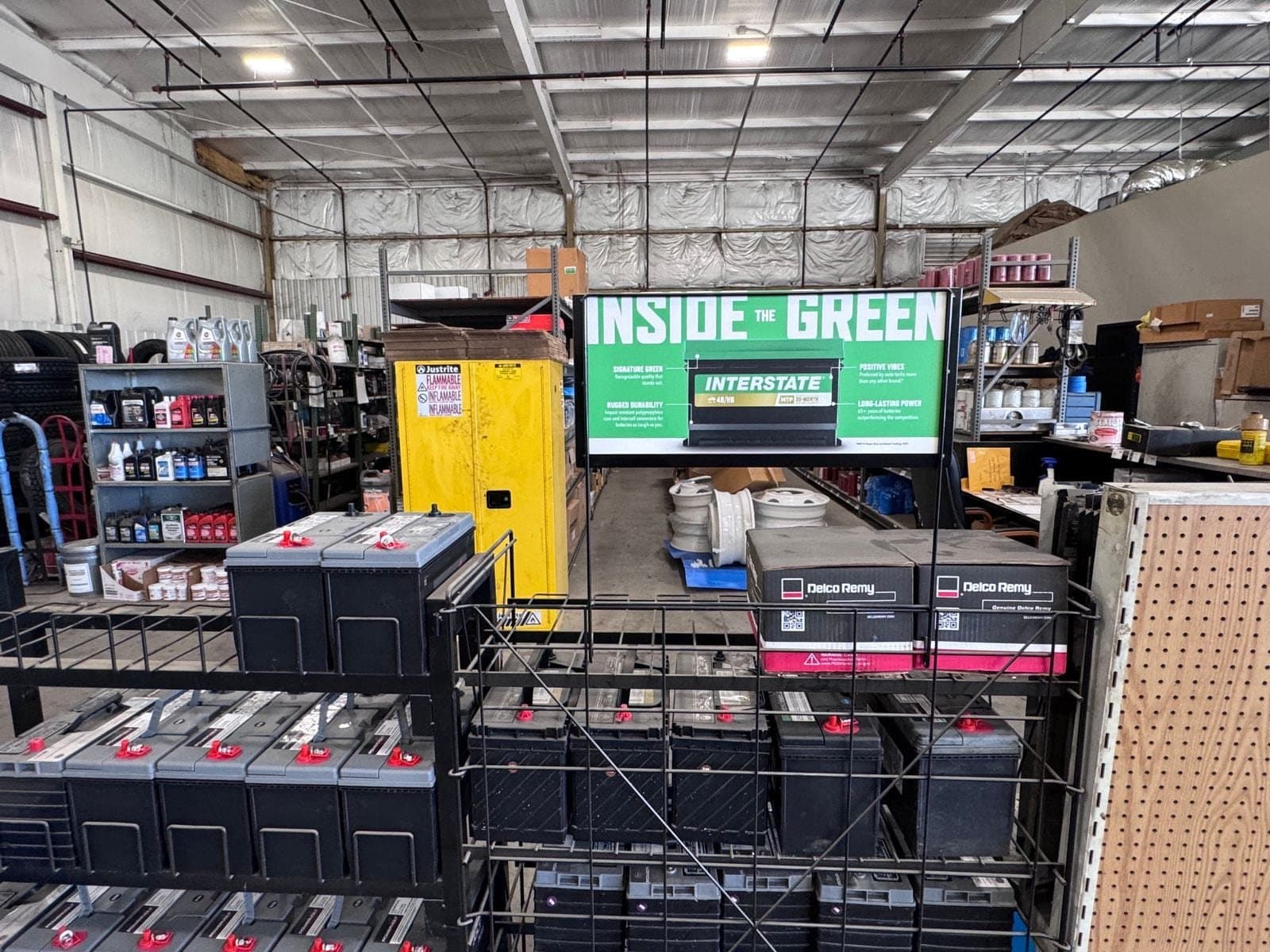 Interstate truck batteries racked and ready in the shop