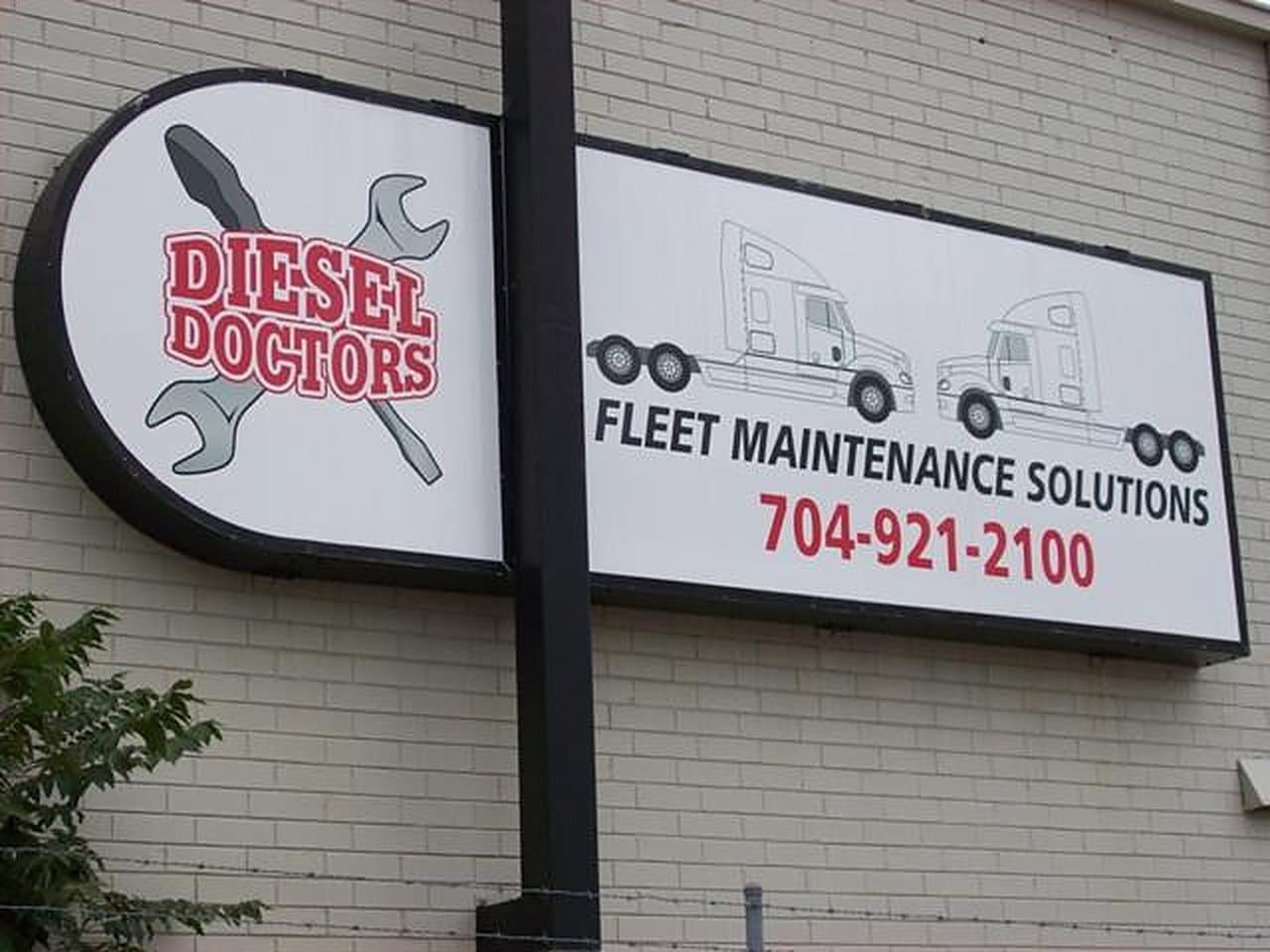 The Diesel Doctors Fleet Maintenance Solutions sign on the shop wall